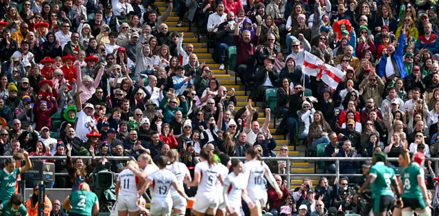 England supporters celebrate their side's third try