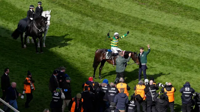 Paul Townend celebrates after winning the Grand National