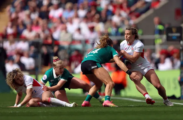 Claudia Moloney-MacDonald of England is tackled by Beibhinn Parsons of Ireland