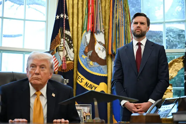 US President Donald Trump and Vice President JD Vance listen to a repoerter's question after Trump signed an executive order on fraud in the Oval Office.