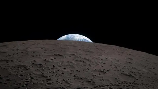 The bright blue disk of the Earth pokes beyond the moon's surface, which takes up half the picture frame