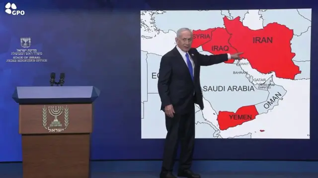 Benjamin Netanyahu pointing to a map of the Middle East