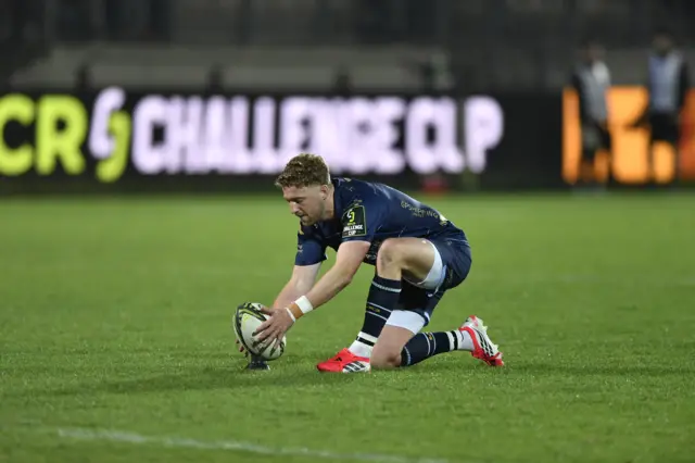 Dragons' Angus O'Brien lines up a kick