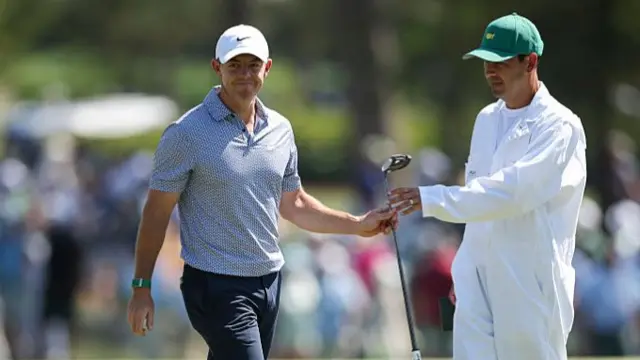Rory McIlroy and Harry Diamond on day three of The Masters 2026