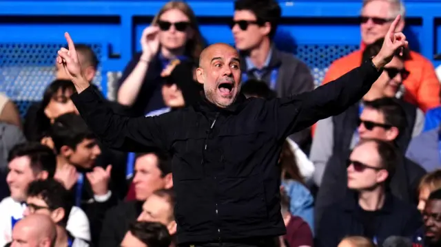 Guardiola gestures on the sideline