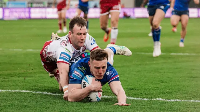 Wakefield Trinity's Jake Trueman scores a try against Wigan Warriors