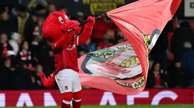 Wrexham mascot flies flag