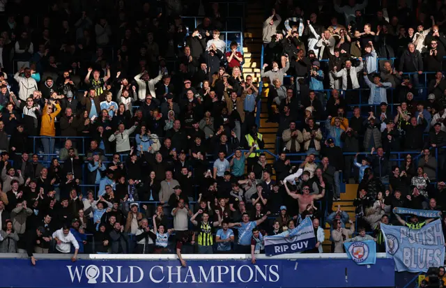 Fans of Manchester City celebrate