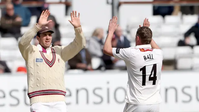 Craig Overton (left) and Jake Ball high-five after Ball takes a wicket