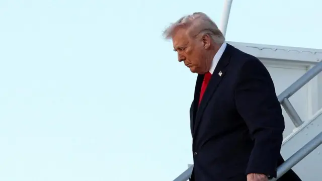 Donald Trump pictured arriving in Miami on Saturday