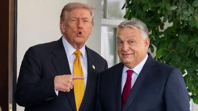 U.S. President Donald Trump (L) greets Prime Minister of Hungary Victor Orban as he arrives at the White House on November 7, 2025.
