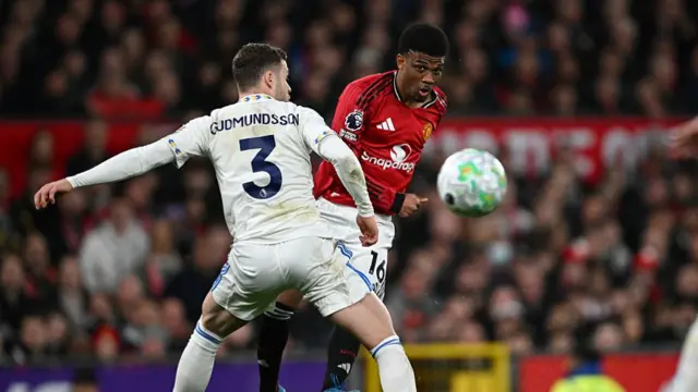 Amad Diallo plays the ball past Gabriel Gudmundsson