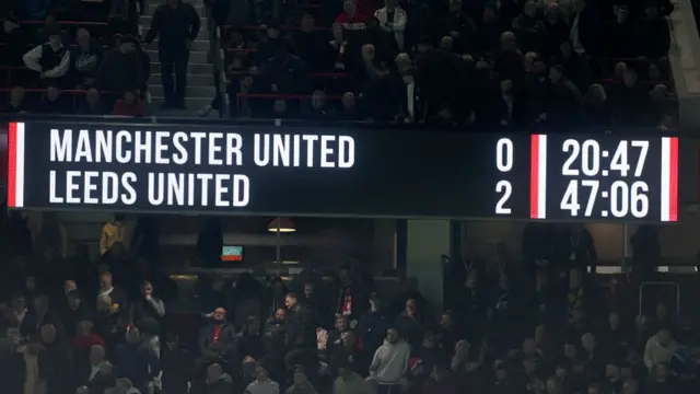 Scoreboard at Old Trafford shows Manchester United 0-2 Leeds United