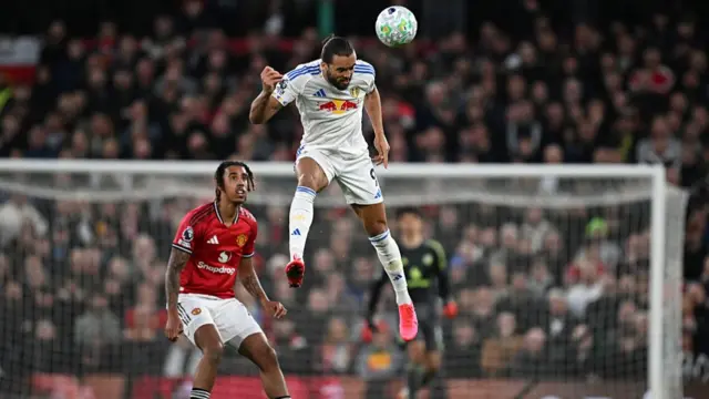 Dominic Calvert-Lewin heads the ball