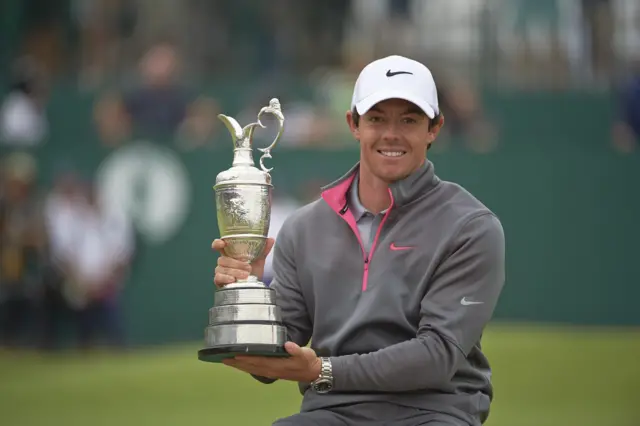 Rory McIlroy victorious with Claret Jug trophy