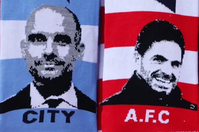 Scarves with Guardiola and Arteta on them