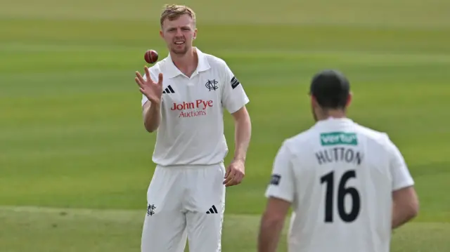 Lyndon James catches a ball before bowling for Notts against Glamorgan