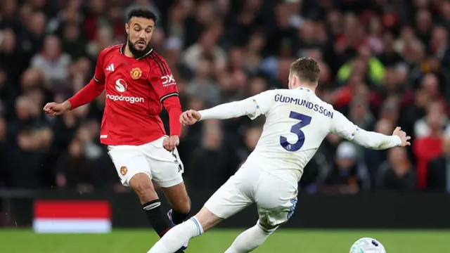 Noussair Mazraoui plays the ball
