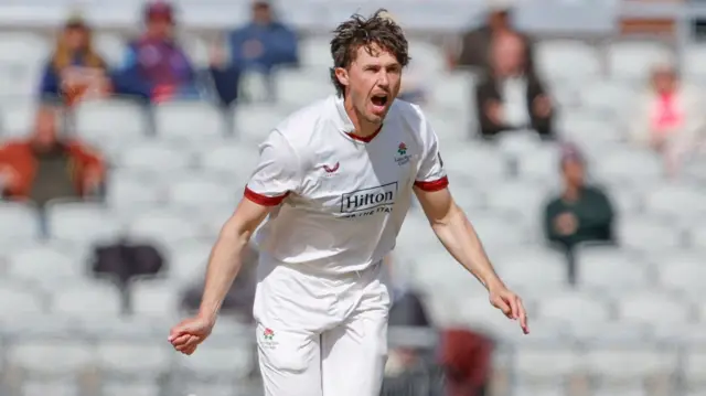 Ben Coughlin celebrates a wicket for Lancs against Derbys