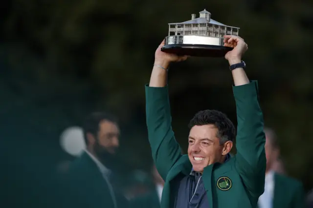 Rory McIlroy poses with the Masters trophy