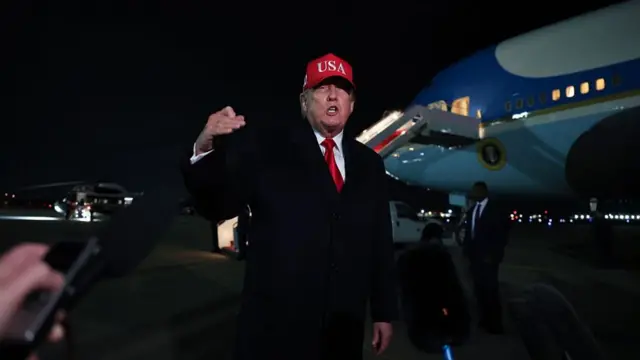 Donald Trump speaks to reporters in front of Air Force One