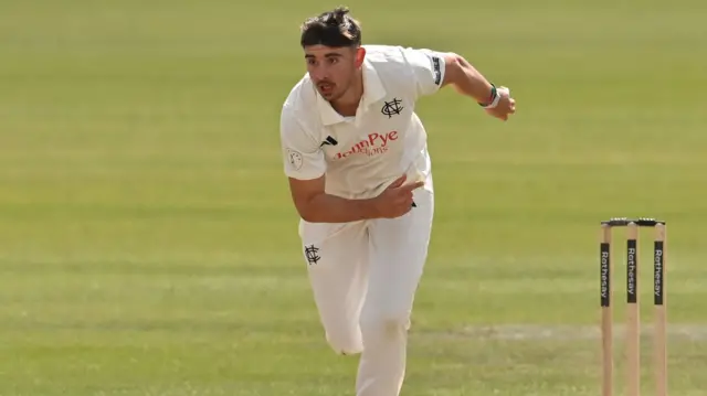 Josh Tongue bowling in the sun for Notts