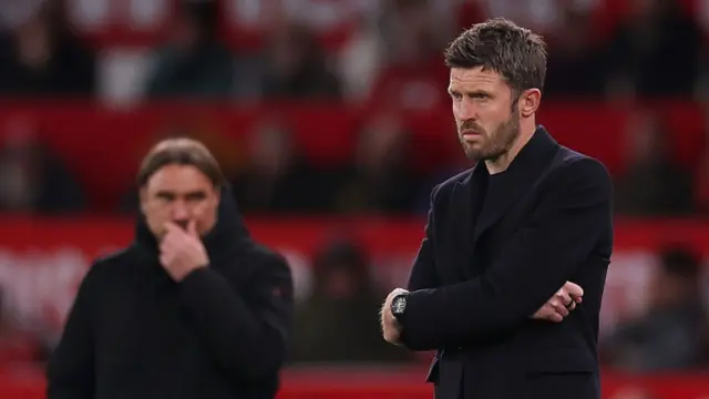 Michael Carrick looks on