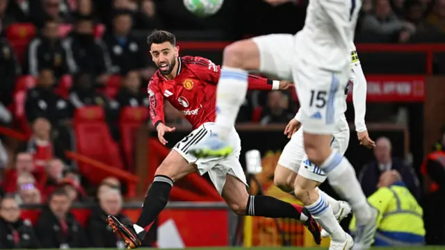 Bruno Fernandes watches his cross