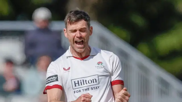 Jimmy Anderson with eyes slightly ajar, takes a wicket for Lancashire