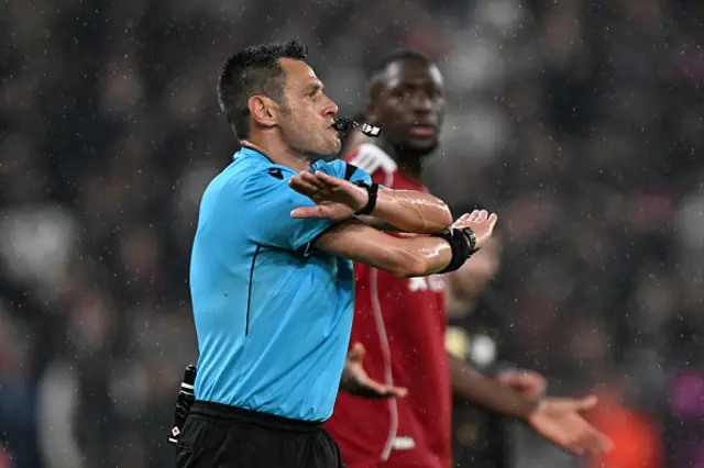 Referee Maurizio Mariani overturns his original decision