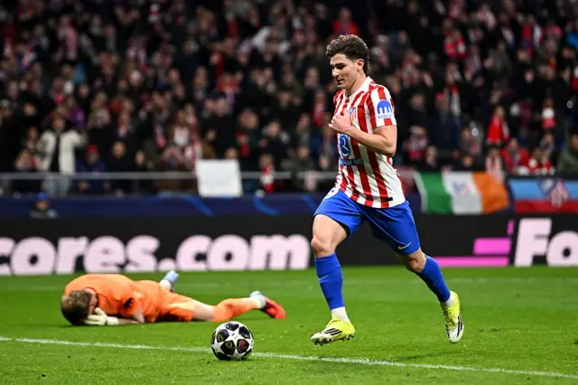 Julian Alvarez with the ball and Antonin Kinsky laying on the pitch