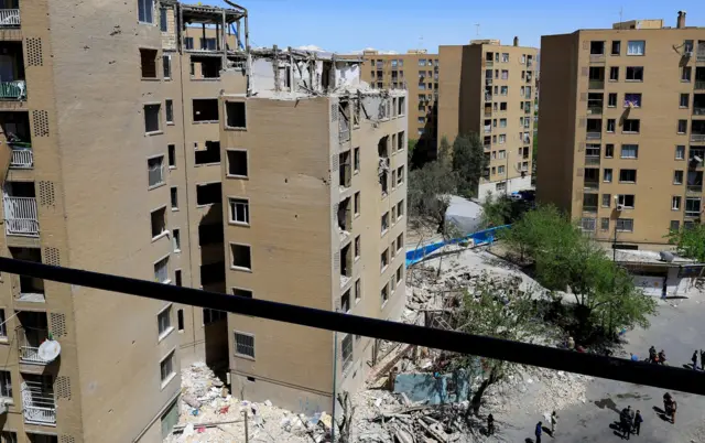 A picture taken on 14 April shows residential buildings damaged by a strike on 4 March in Tehran