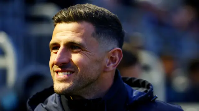 A smiling Portsmouth boss John Mousinho