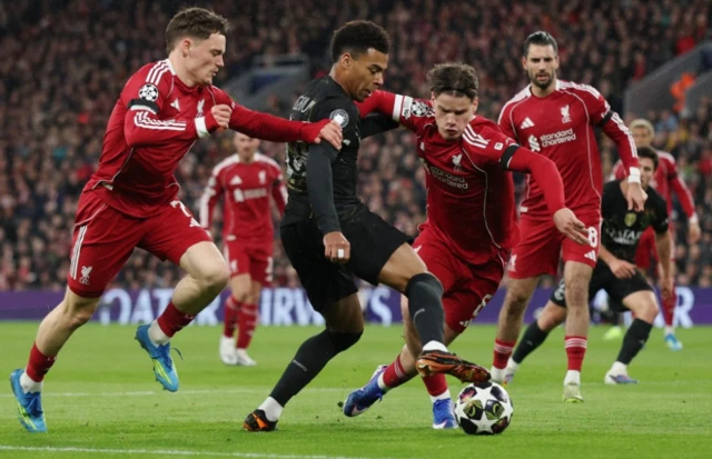 Liverpool's Florian Wirtz and Milos Kerkez in action