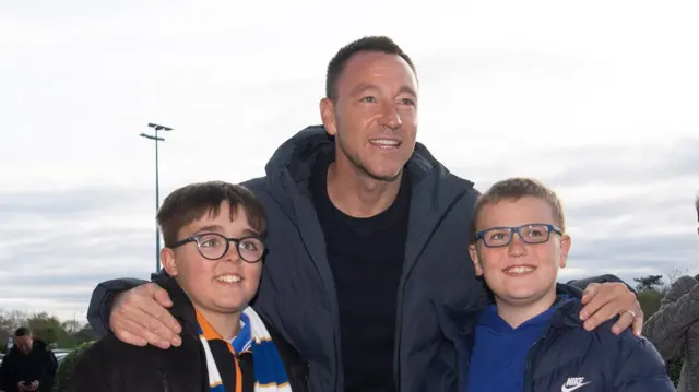 Former England defender John Terry meets Colchester fans ahead of their game against Accrington