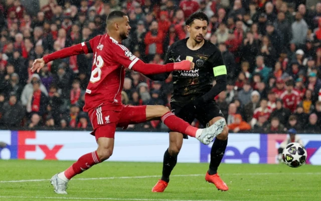 Liverpool's Cody Gakpo in action with Paris St Germain's Marquinhos