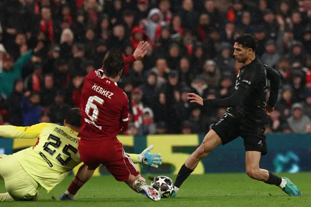 Achraf Hakimi (R) has this shot blocked by Liverpool's Hungarian defender #06 Milos Kerkez and Liverpool's Georgian goalkeeper #25 Giorgi Mamardashvili