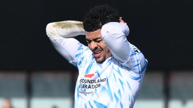 Barrow's Josh Gordon winces in frustration after missing a chance against Barnet