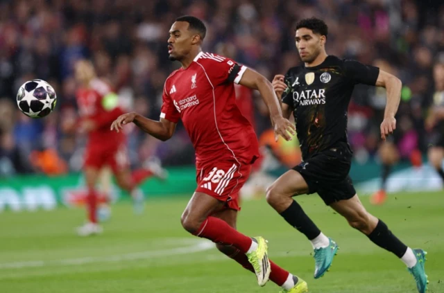 Liverpool's Ryan Gravenberch in action with Paris St Germain's Achraf Hakim