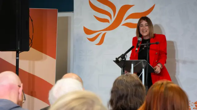 Jane Dodds speaking at a lectern
