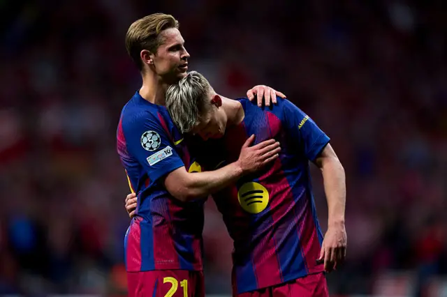 Frenkie de Jong and Dani Olmo of FC Barcelona embrace after the game