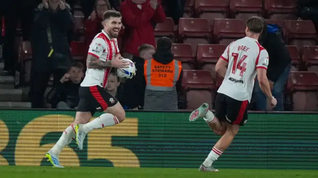 Ryan Manning celebrates with Southampton team-mate James Bree