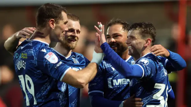 Gillingham celebrate Ronan Hale's goal at Cheltenham