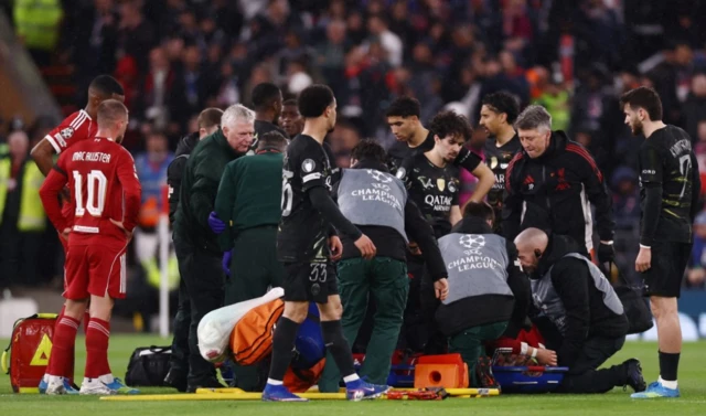 Liverpool's Hugo Ekitike receives medical attention