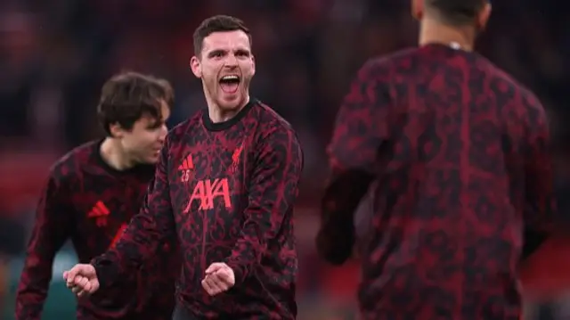 Andy Robertson warms-up