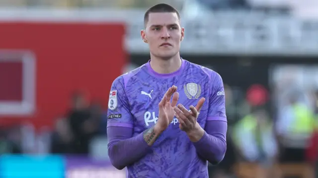 Rotherham goalkeeper Ted Cann applauds the Millers fans after a defeat