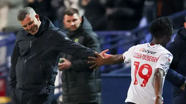 Steven Schumacher high-fives Amario Cozier-Duberry