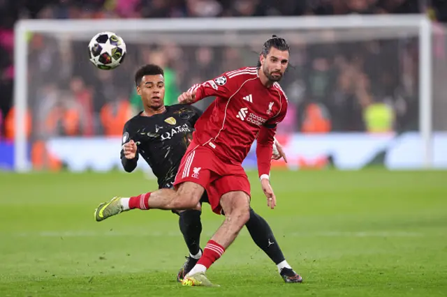 Dominik Szoboszlai of Liverpool in action with Desire Doue