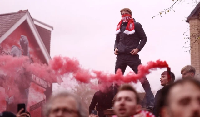 Liverpool fans with flares outside the stadium