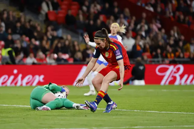 Caldentey reacts as Hampton falls on the ball before she can shoot